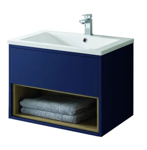 Sapphire blue wall-hung bathroom vanity unit with white ceramic sink, chrome mixer tap, and open shelf storage displaying folded grey towels