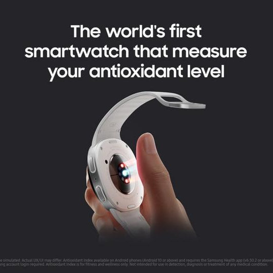 Samsung Galaxy Watch 8 Cellular LTE 44mm smartwatch in white with curved display held in hand showing red and blue LED lights for antioxidant level measurement feature