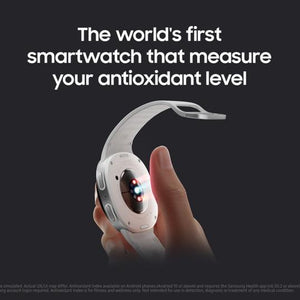 Samsung Galaxy Watch 8 Cellular LTE 44mm smartwatch in white with curved display held in hand showing red and blue LED lights for antioxidant level measurement feature