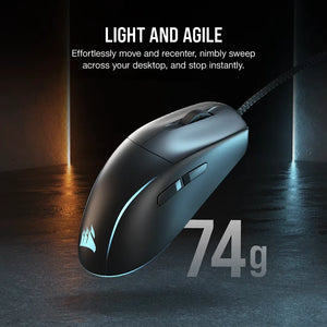 Corsair M75 lightweight gaming mouse in black with RGB lighting, weighing 74g, displayed against a dark background with blue and orange ambient lighting, showing ergonomic design with braided cable