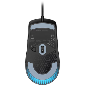 Corsair M75 lightweight RGB wired gaming mouse in black with light blue accents, featuring a honeycomb design body, central scroll wheel, side buttons, and illuminated bottom ring on white background