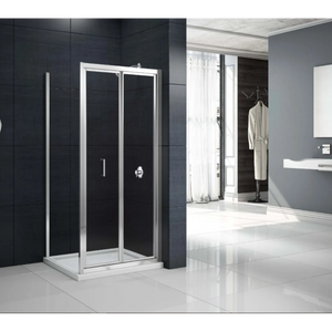 Merlyn MBOX bifold shower enclosure with chrome frame and black glass panels in modern bathroom with white floor tiles and dark wall tiles
