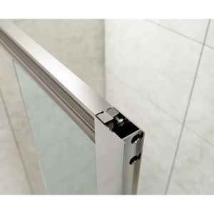 Close-up detail of Merlyn MBOX bifold shower door frame showing white aluminium profile with chrome hardware and black internal mechanisms against white tiled bathroom wall