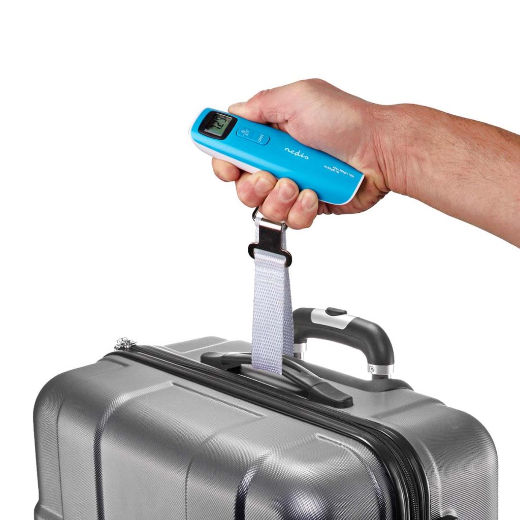Hand holding a blue digital luggage scale on a suitcase with a white background