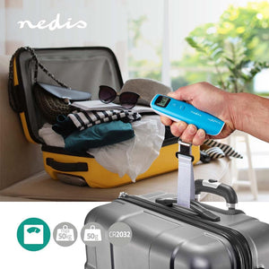 Hand holding a digital luggage scale next to an open suitcase with clothes and a yellow suitcase.
