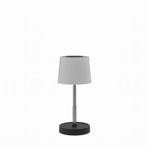 White lamp with black base on a white background