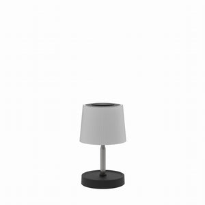 White lamp with black base on a white background