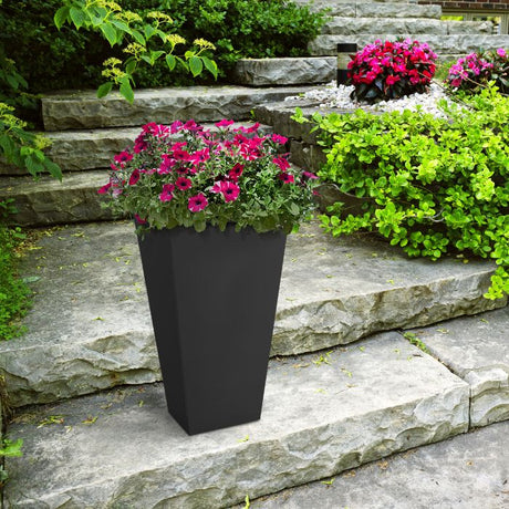 Tierra Verde Sonata slate grey square garden planter with magenta petunias on stone steps surrounded by lime green foliage and flowering plants