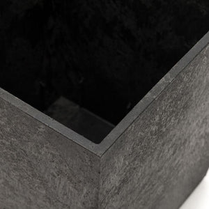 Close-up detail of slate grey concrete garden planter showing textured surface and clean angular edge design