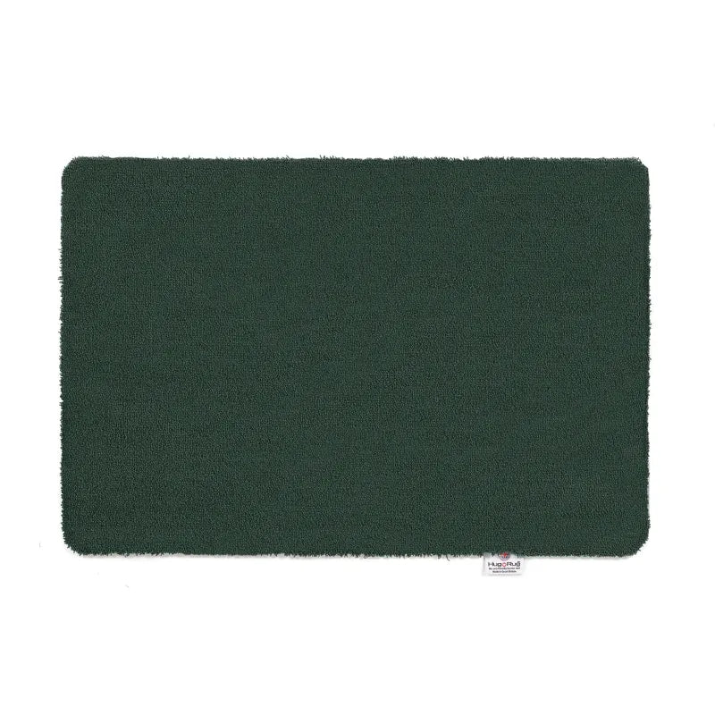 Forest green Hug Rug doormat with soft textile surface and rounded corners, 50cm x 75cm size shown against white background