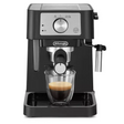 DeLonghi Stilosa black espresso coffee machine with stainless steel portafilter dispensing espresso into a glass cup, featuring rotary dial control panel and drip tray