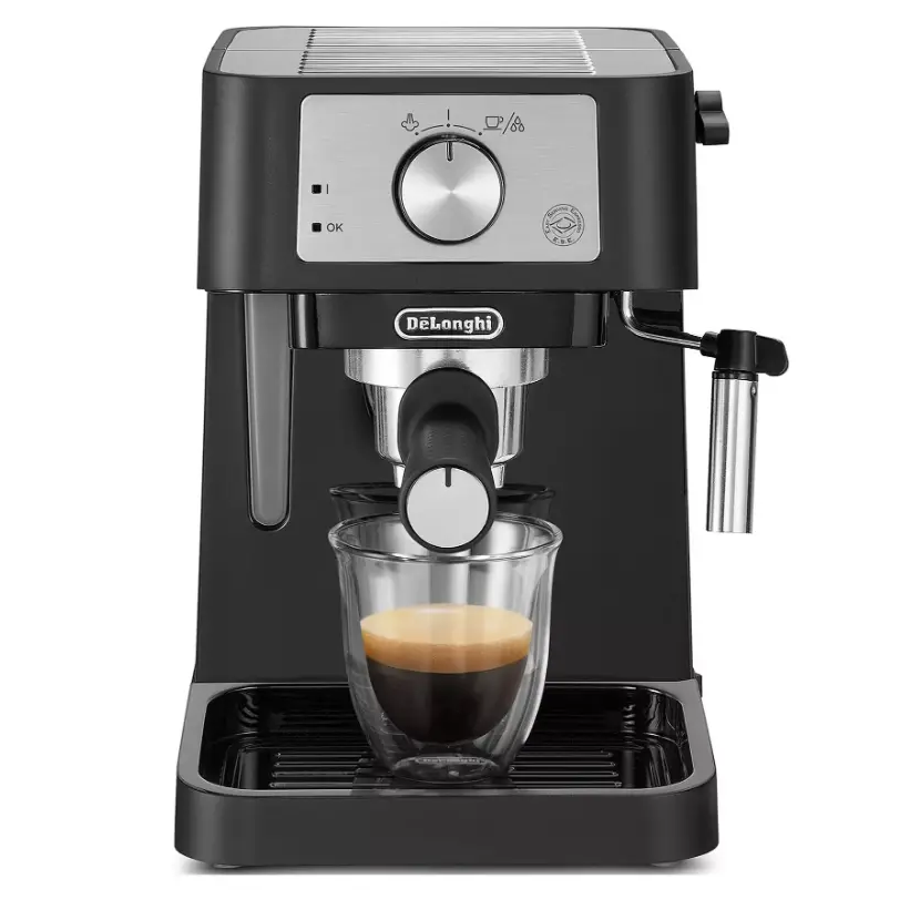 DeLonghi Stilosa black espresso coffee machine with stainless steel portafilter dispensing espresso into a glass cup, featuring rotary dial control panel and drip tray