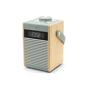 Roberts Rambler Midi DAB+ FM radio with Bluetooth in duck egg blue and natural wood finish, featuring digital display showing 23:02, metal speaker grille, top-mounted tuning dial, and carrying strap