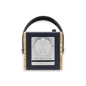 Roberts Rambler Midi DAB+ FM radio with Bluetooth in navy blue and natural wood grain finish, featuring a large chrome volume knob, digital display screen with touch controls, black leather carrying handle, and brushed metal front panel