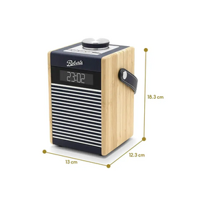 Roberts Rambler Midi DAB+ FM radio with Bluetooth in navy blue and natural wood finish, featuring digital display showing 23:02, black leather carrying strap, and dimensions of 13cm width, 12.3cm depth, and 18.3cm height