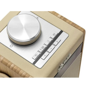 Roberts Rambler Midi DAB+ FM radio in pastel cream with silver control dial and buttons on natural linen fabric exterior, featuring Bluetooth connectivity