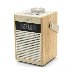 Roberts Rambler Midi DAB+ FM radio with Bluetooth in pastel cream with wooden effect sides, digital display showing time, perforated speaker grille, rotary tuning dial and carrying handle