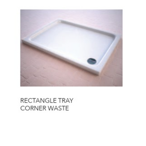 White rectangular acrylic shower tray with corner waste drain positioned on wooden flooring, showing slimline design with raised edges and dark drain outlet visible on lower right corner