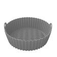 Gray silicone air fryer liner with round shape, ribbed walls, wavy bottom pattern, and dual handles for Kitchen Academics brand