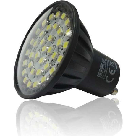 Eveready 3W SMD LED GU10 bulb with warm white light, black plastic housing with multiple yellow LED chips visible on reflective metal base plate, shown at angle against white background with reflection