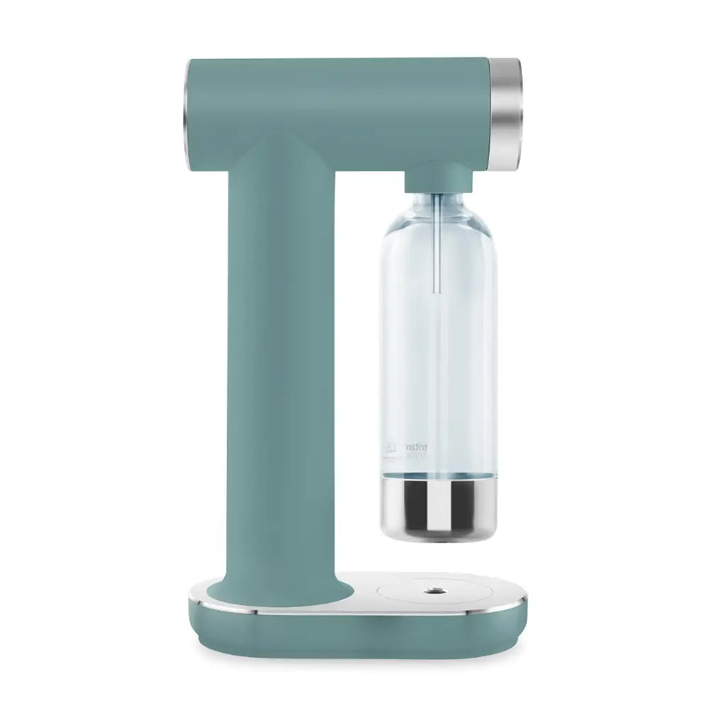 Smeg Sparkling Water Soda Maker in Emerald Green with T-shaped body, stainless steel accents, and clear glass carbonation bottle attached to the side