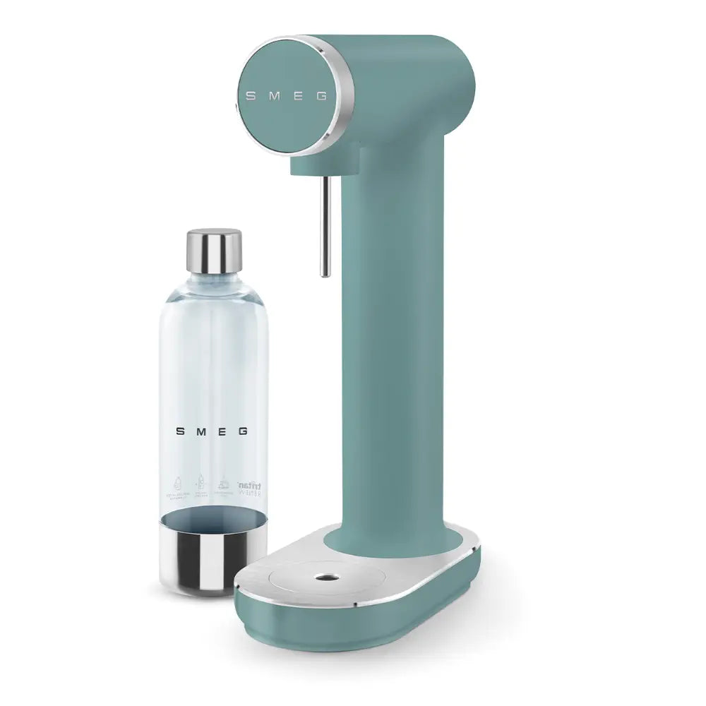 Smeg Sparkling Water Soda Maker in Emerald Green with cylindrical body, circular control panel, stainless steel accents, white base, and included glass bottle with metal base