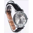 Newgrange Living Black Bezel Ladies Watch in silver with black leather strap, featuring a silver dial, crystal-studded bezel, date window, and tan perforated leather interior visible on band