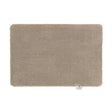Hug Rug Doormat in Sense Beige, 50cm x 75cm rectangular mat with soft textured surface and rounded corners, featuring brand label tag