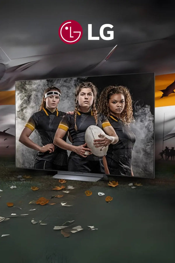 a group of women holding a rugby ball