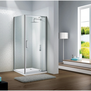 Modern chrome framed pivot door shower enclosure with clear glass panels and white tray on wooden bathroom floor next to window