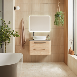 Modern bathroom vanity unit in sand oak with white ceramic basin, illuminated mirror, wall-mounted storage drawers, natural wood finishes and contemporary styling with potted plants and neutral tones