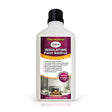 Thermalmix insulating paint additive bottle with black cap and white label featuring purple and orange branding, showing product benefits and a cozy fireplace interior scene, suitable for mixing with 5 litres of paint