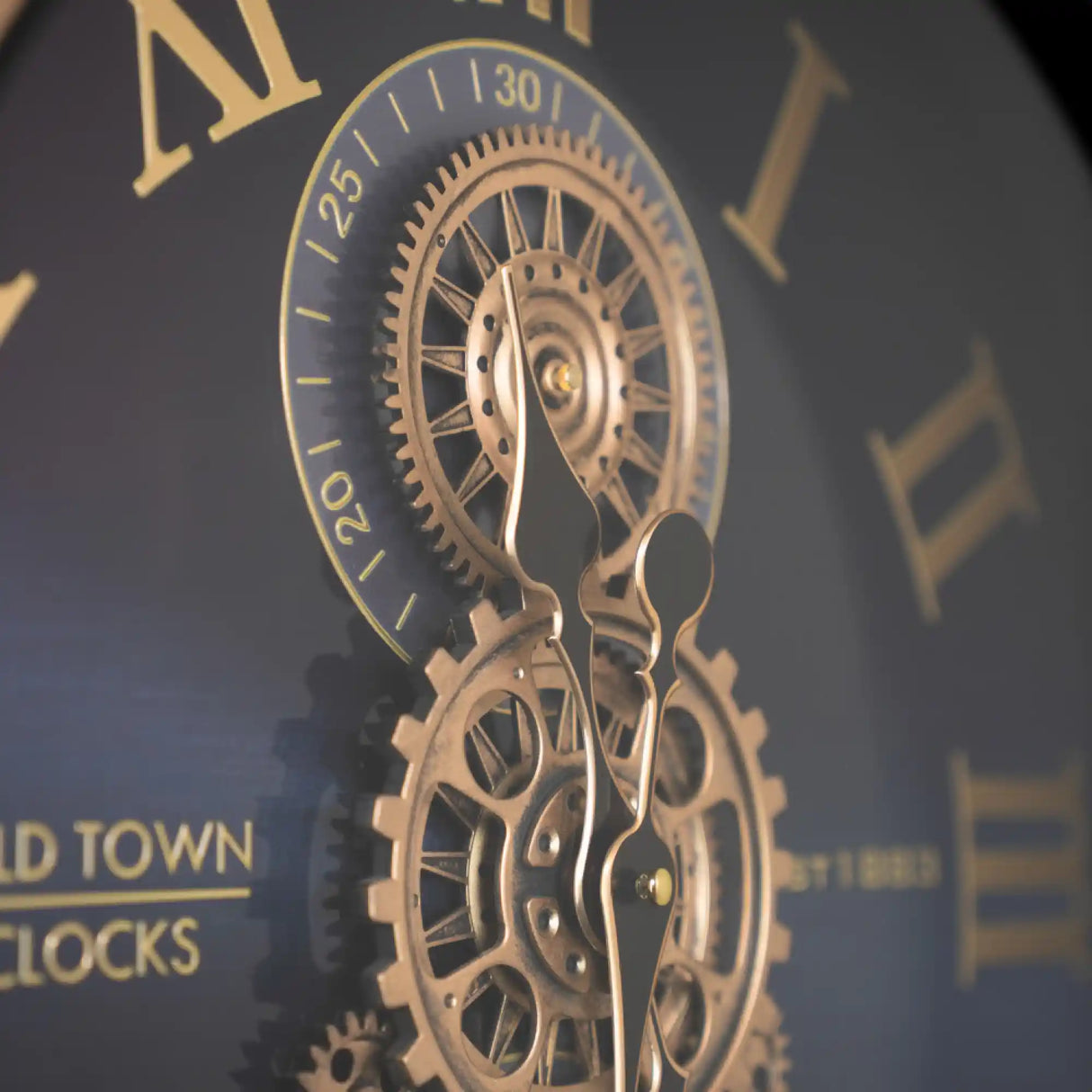 Tara Lane Old Town Gears Clock 50cm Black and Gold steampunk-style wall clock featuring exposed bronze gears and Roman numerals on dark face