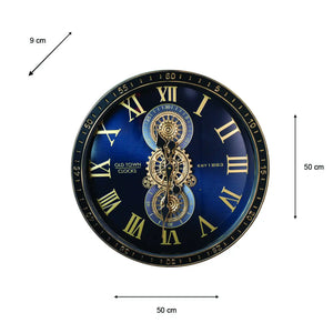 Large decorative wall clock 50cm diameter with black and gold steampunk design, featuring Roman numerals, exposed brass gears and mechanical components on navy blue face, Old Town Clocks branding, accompanied by 9cm scale reference