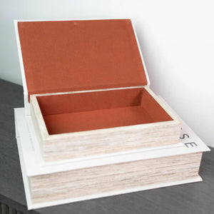 Two nested wooden storage boxes with terracotta red linen-lined interiors, natural light wood exterior with white trim, open lid design, modern minimalist style
