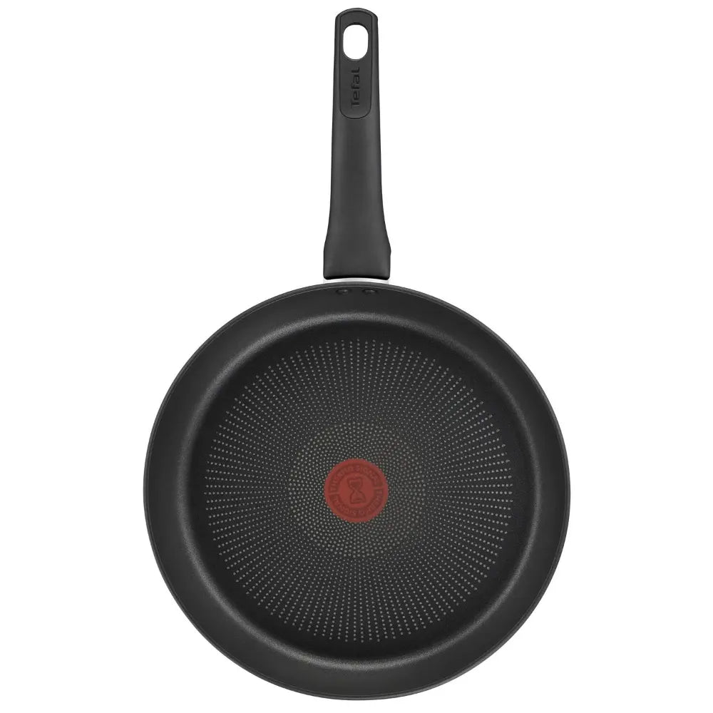 Tefal Ultimate black frying pan 30cm with non-stick honeycomb interior surface and red heat indicator dot, featuring black handle on white background