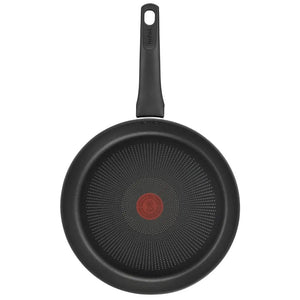 Tefal Ultimate black frying pan 30cm with non-stick honeycomb interior surface and red heat indicator dot, featuring black handle on white background
