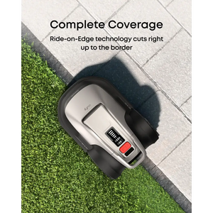 Eufy E18 robot lawn mower shown from above on grass and paved border demonstrating Ride-on-Edge technology for complete coverage, silver and black device with red control button visible