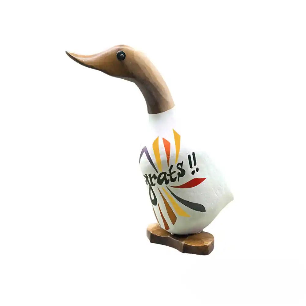 Wooden decorative duck figurine with natural wood head and neck, white ceramic body featuring colorful hand-painted design with yellow, orange, red and black stripes, text reading "greats!!" and standing on wooden base, Irish congratulations gift item