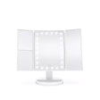 White LED touch dimmable tri-fold vanity mirror with illuminated central panel and side wings on white pedestal base