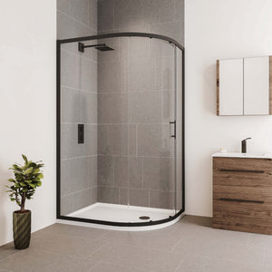 Modern bathroom with Flair Verve Pro black framed quadrant shower enclosure featuring curved glass door, grey tile walls, white base tray, wooden vanity unit with white basin, chrome tap, mirror cabinet, potted plant and neutral floor tiling