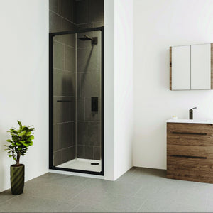 Modern bathroom featuring Flair VERVE PRO bifold shower door with matt black frame and grey tile walls, paired with wooden vanity unit, white sink, mirror cabinet, potted plant and grey floor tiles