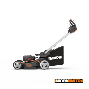 Worx Nitro 40V brushless self-propelled lawn mower with 46cm cutting deck, featuring black and orange design, silver handle, white wheels, and grass collection bag on white background