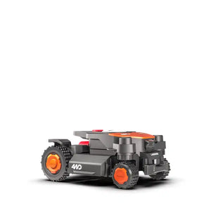 Worx Landroid Vision AI RTK 4WD robotic lawnmower with orange and black design, featuring all-terrain tires and compact body, shown against white background