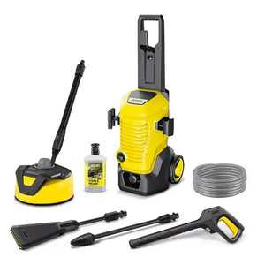 Kärcher K5 yellow and black pressure washer kit with accessories including surface cleaner, spray gun, hose, detergent bottle and extension wand displayed on white background