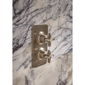 Roper Rhodes Walcot concealed shower valve in brushed nickel with dual cross handles mounted on white Carrara marble tile wall