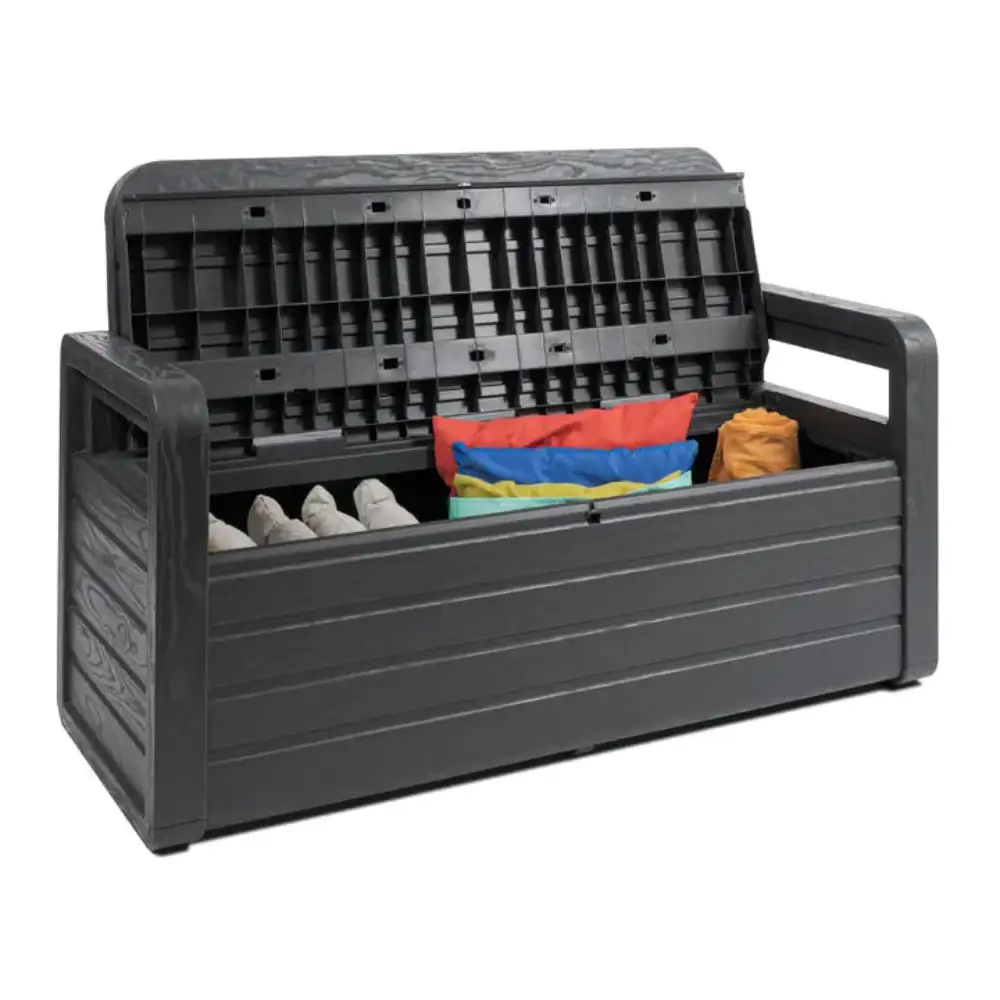 Toomax Storaway anthracite grey plastic garden storage bench with lid open showing 263 litre capacity, containing folded colorful textiles and rolled towels