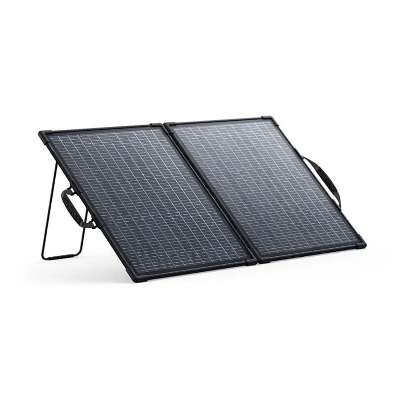 Anker SOLIX PS100 bifacial portable solar panel with two foldable black solar panels on stand, featuring grid pattern surface and carrying handle
