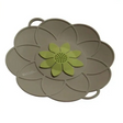 Collage showing Kitchen Academics silicone lids with flower-shaped design in beige, yellow and blue, displayed on red cookware and as standalone product shots demonstrating anti-spill and boil-over prevention functionality
