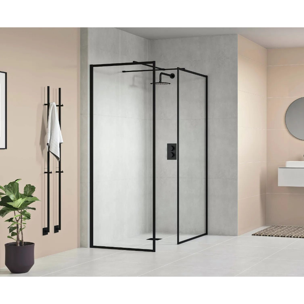 Modern matte black framed corner shower enclosure with 8mm clear glass panels in contemporary bathroom with beige and grey tile walls, black towel rail and potted plant